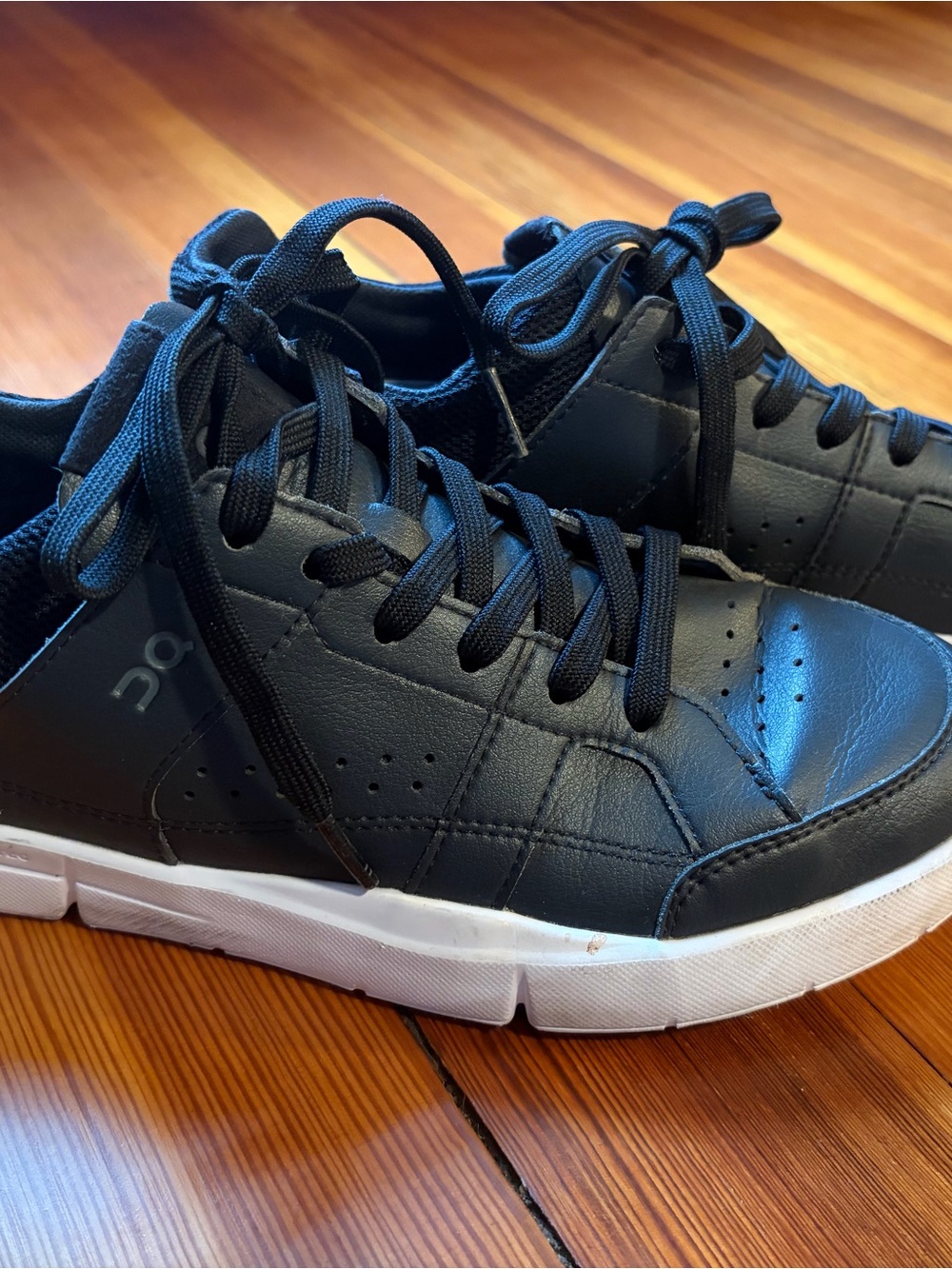 On Running Women’s 8.5 Black Low-Top Sneakers with White Sole